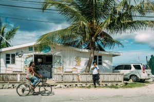 Men in front of a building on a hot day, Negril, Jamaica