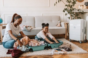 Mother and daughter packing for their next move